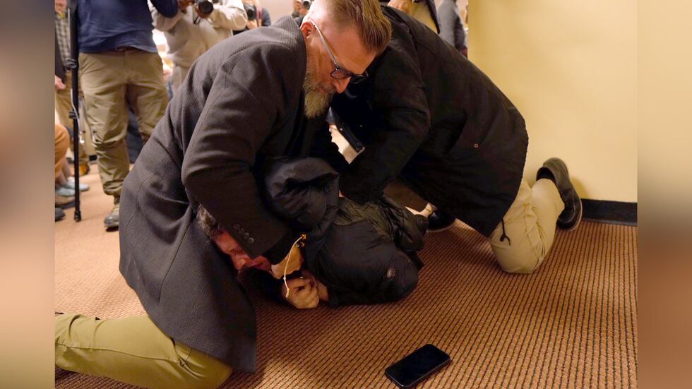 Security tackles man who sprayed unknown substance at Rep. Ilhan Omar during Minneapolis town hall